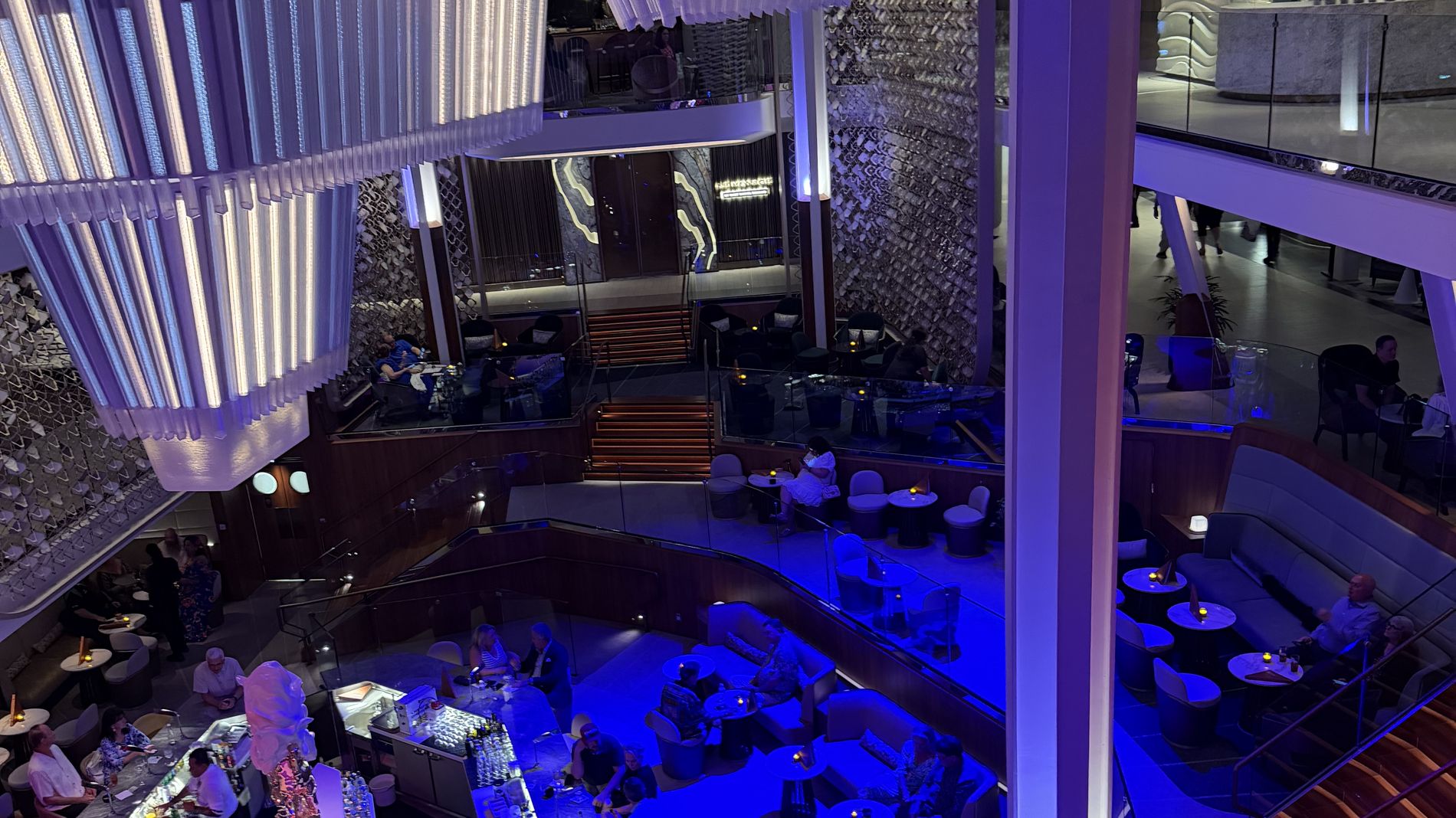 The three-deck Grand Plaza atrium at night with the LED Chandelier above the Martini Bar