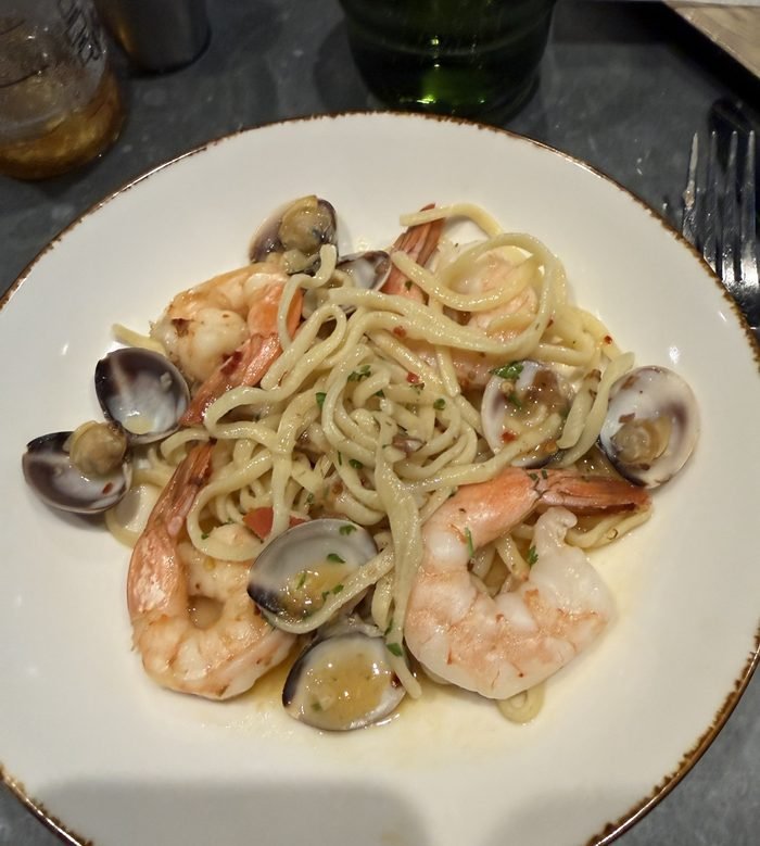 A bowl of fresh pasta with whole shrimp, clams, chili flakes and parsley at Giovanni's Kitchen.