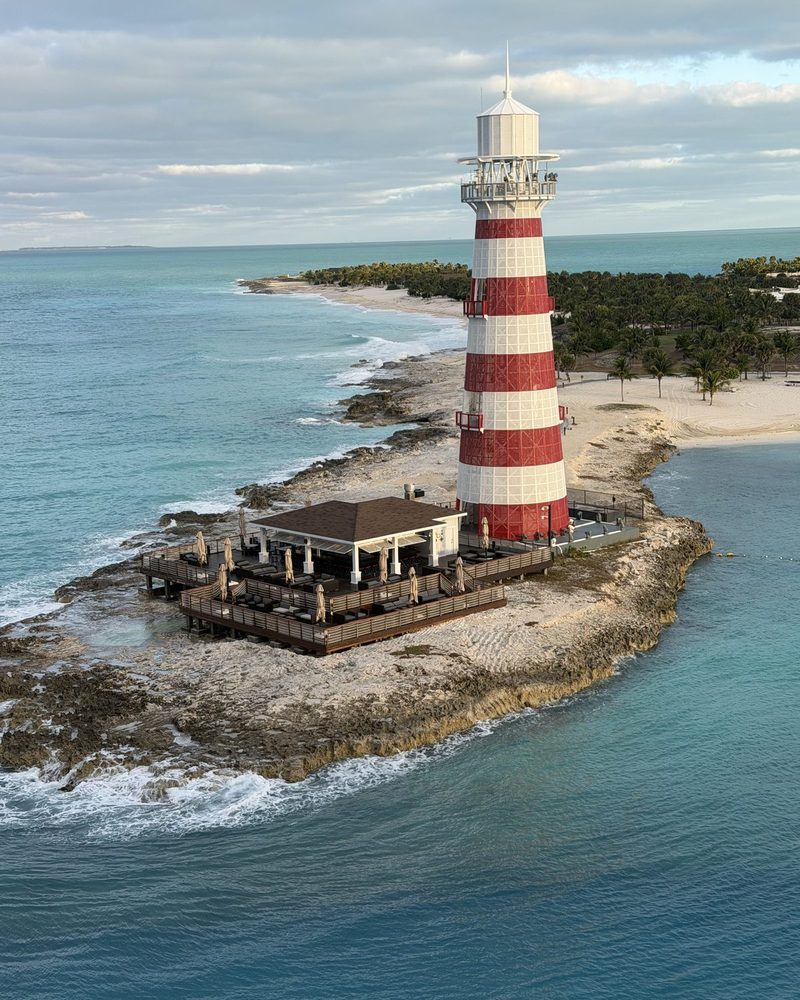 Aerial view of a private-island lighthouse bar over turquoise water