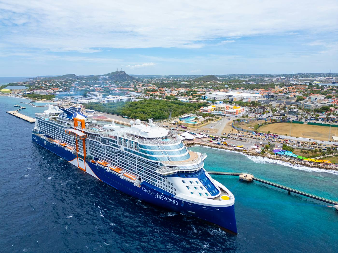Celebrity Beyond cruise ship docked in Curacao Caribbean port aerial view
