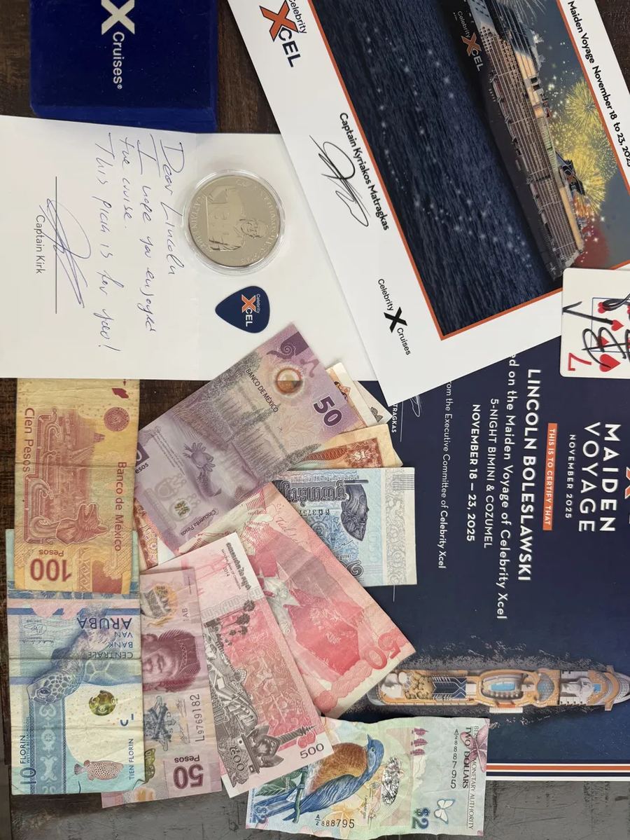 Foreign currency, a signed maiden voyage certificate, and other keepsakes Lincoln collected from crew members on a cruise.