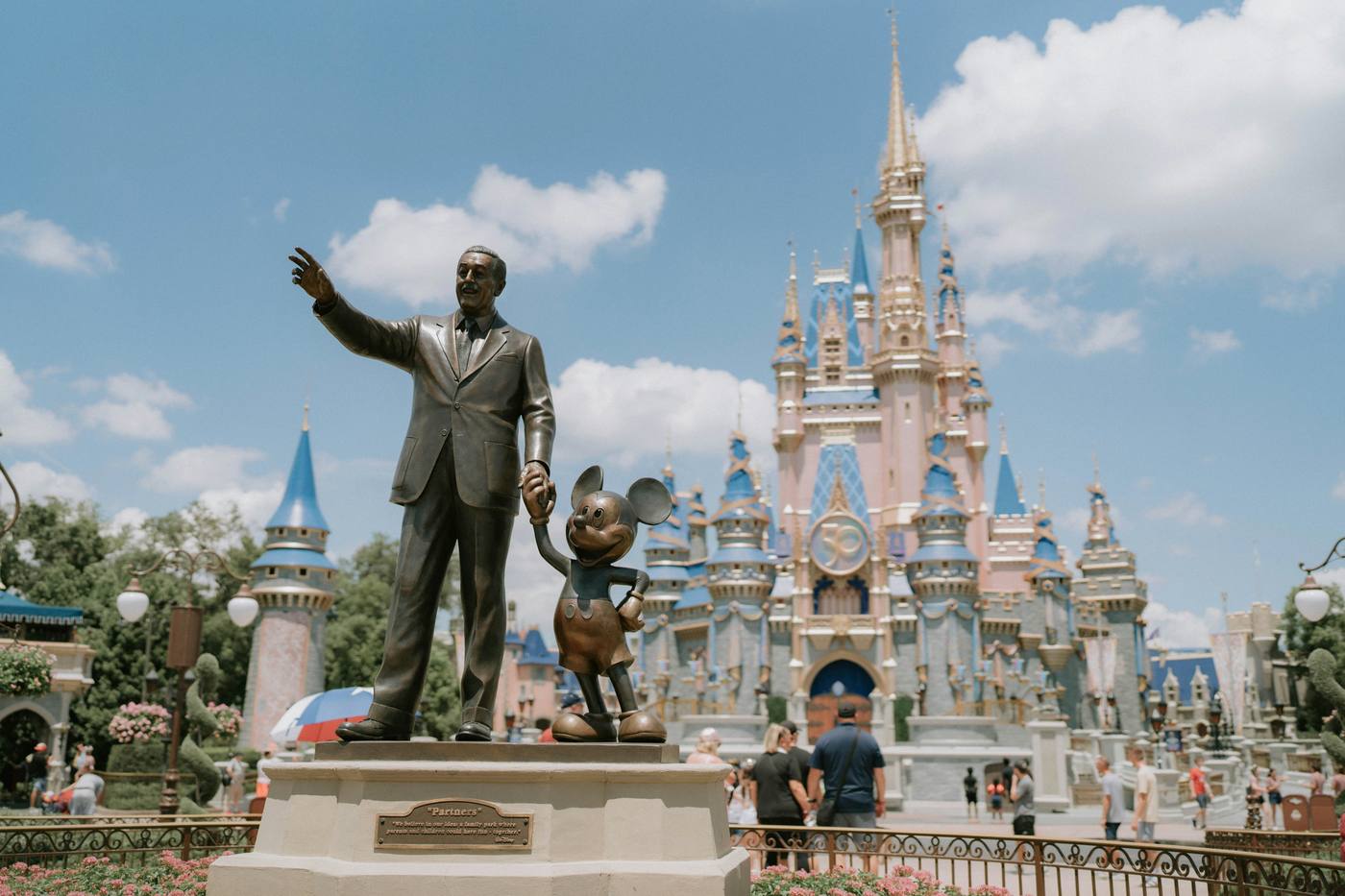 Walt Disney World Magic Kingdom castle with Partners statue